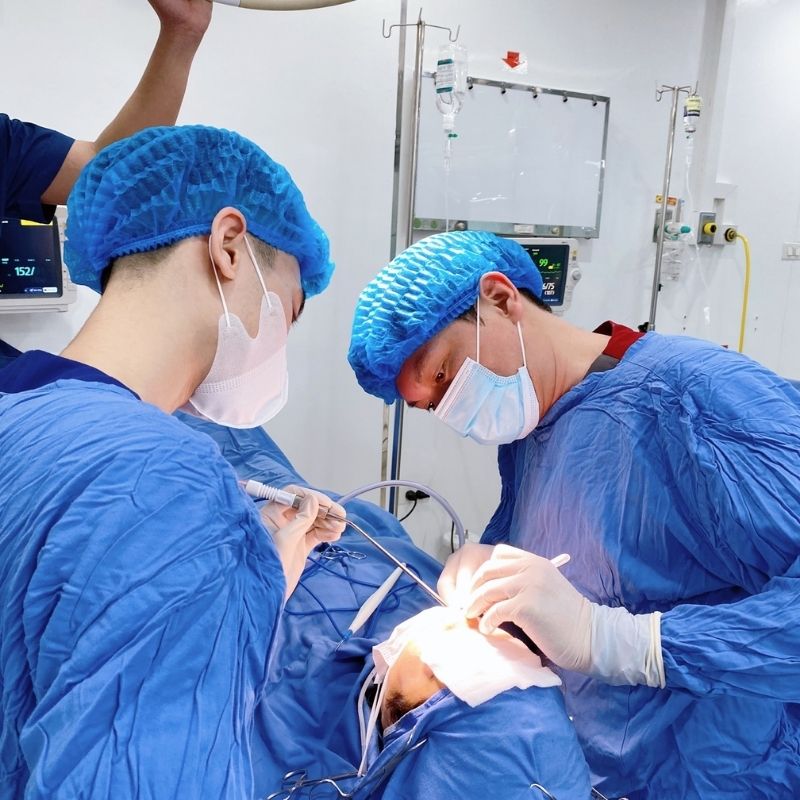 The surgeon performs precise rhinoplasty techniques