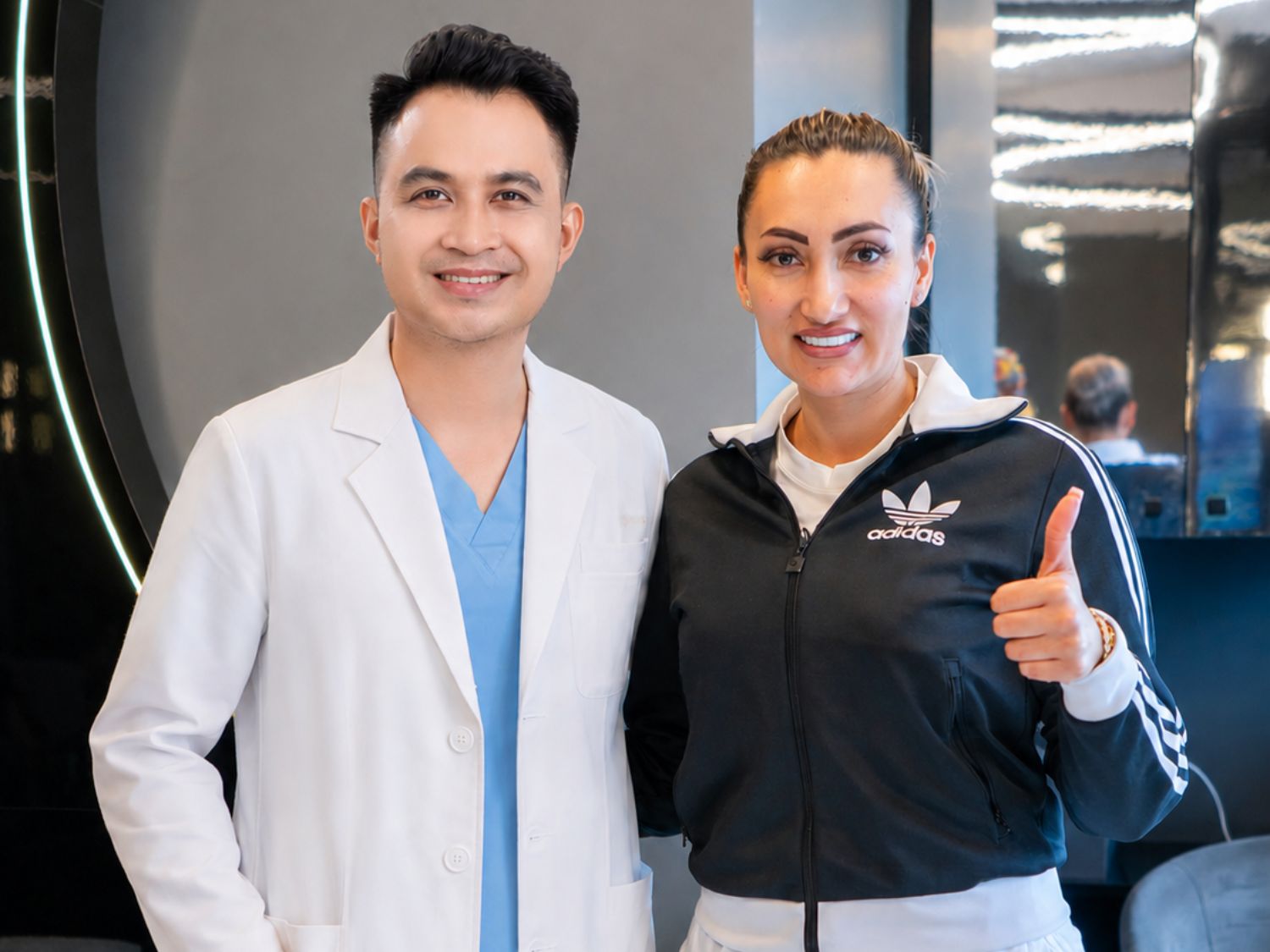 Dr. Nicolas Hung and client Lani at their follow-up appointment. 