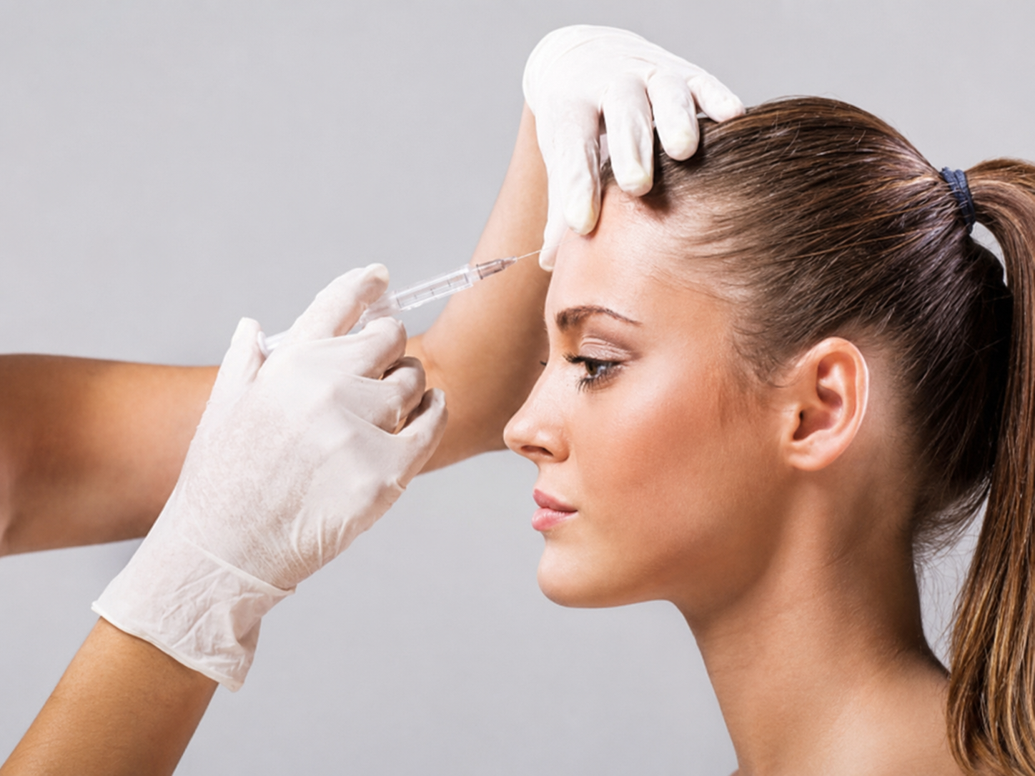Dermal filler injections to fill the forehead