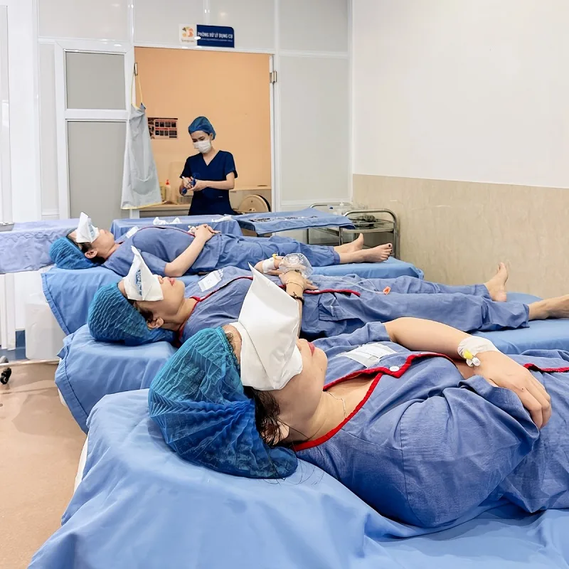 After the rhinoplasty procedure, the client receives post-operative care and cold compresses to reduce swelling. 