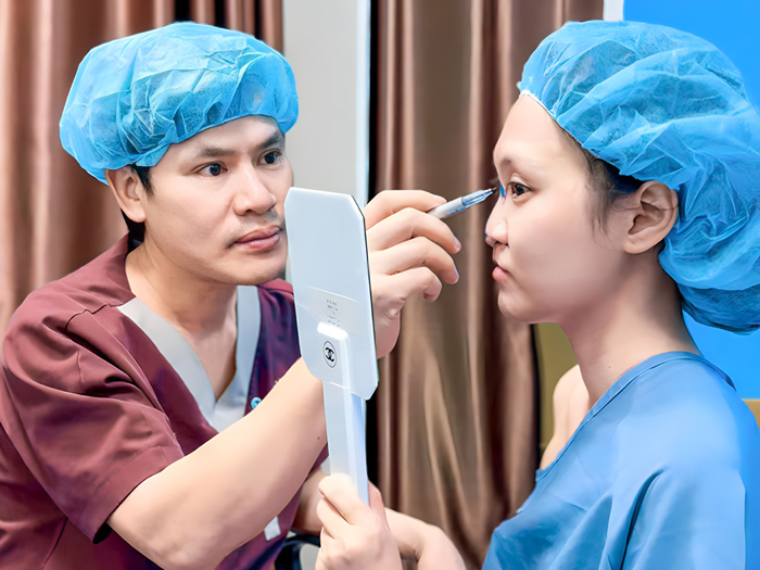 The surgeon measures and designs the proposed nasal shape before surgery.